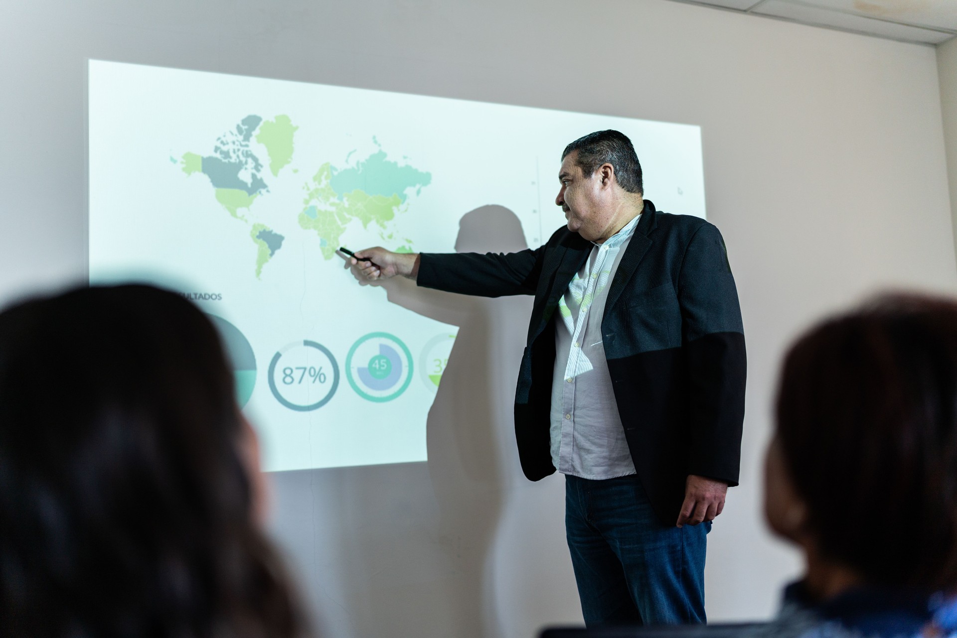 Mature businessman doing a presentation at meeting office